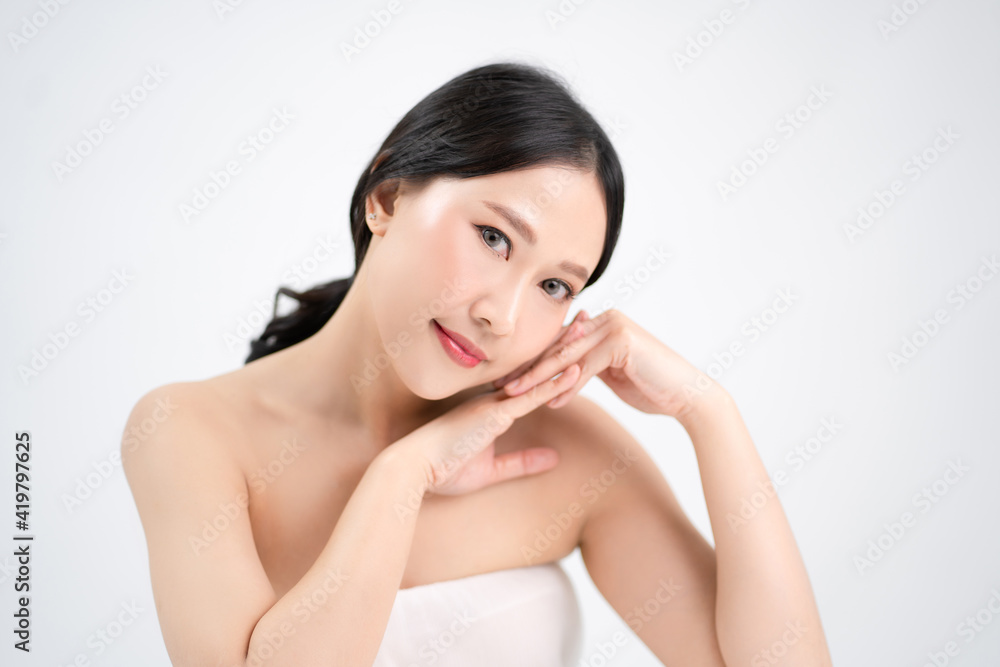 Asian beautiful women have a youthful face. She touched her white and bright skin. Asian beautiful women have a youthful face. She touched her white and bright skin.