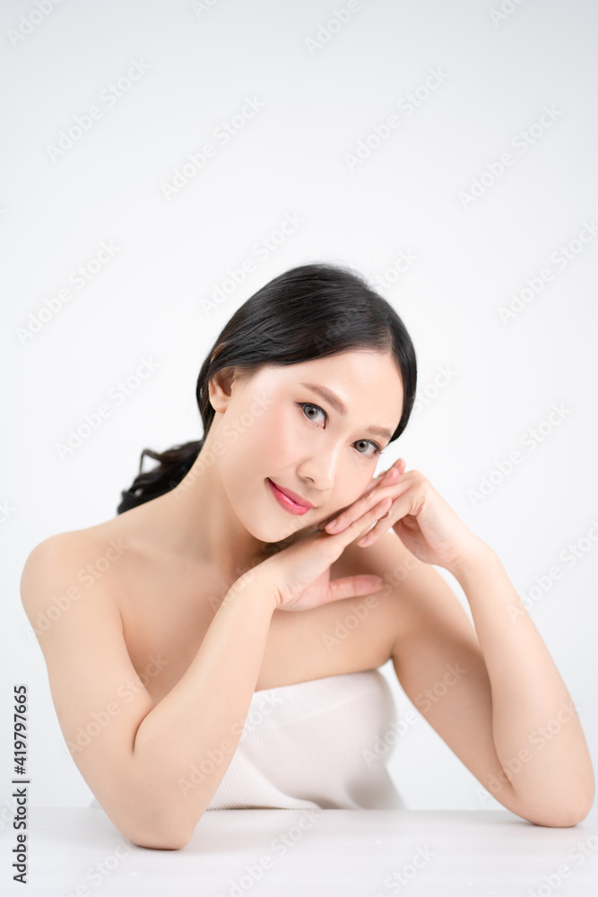 Asian beautiful women have a youthful face. She touched her white and bright skin. Isolated from the white background. Asian beautiful women have a youthful face. She touched her white and bright skin. Isolated from the white background.