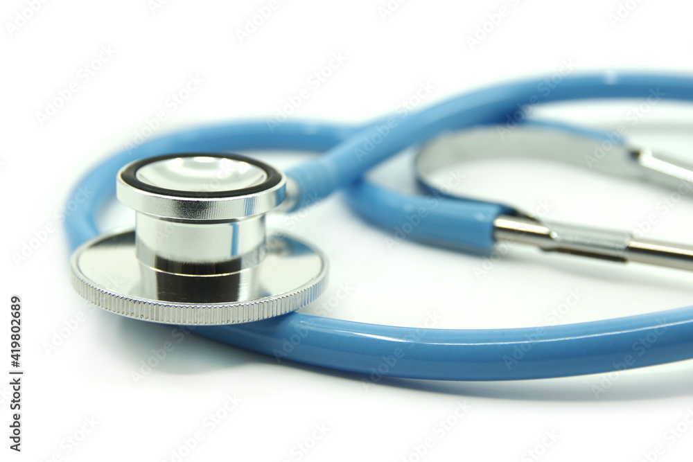 Blue stethoscope on white background. Medical devices For treatment. Healthcare concept. Blue stethoscope on white background. Medical devices For treatment. Healthcare concept.