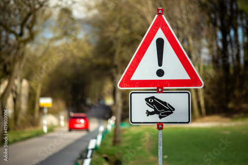 As common frogs enter mating season warning signs are erected for drivers on country roads in Germany.