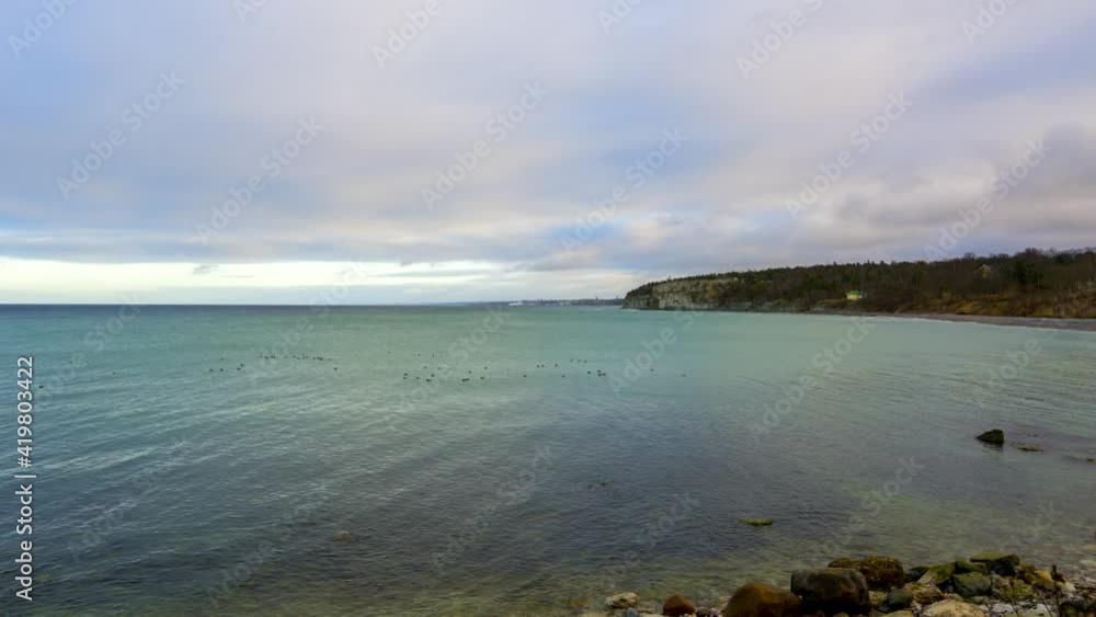Time lapse clouds passing over ocean and coastal landscape on island Gotland, Sweden Time lapse clouds passing over ocean and coastal landscape on island Gotland, Sweden