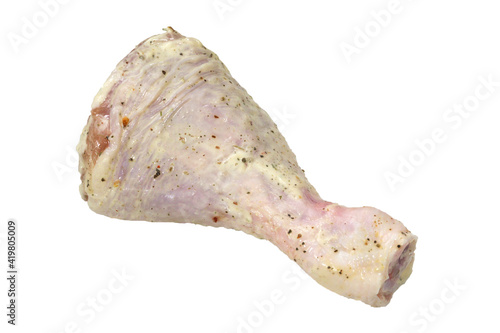 Chicken leg marinated ready for barbecue on isolated white background