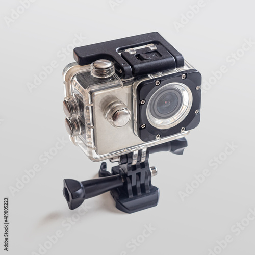 Action camera in a transparent plastic case on a light background