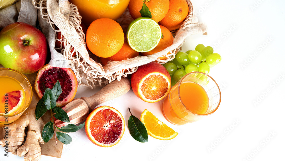 Healthy home made juices and fruits on light wooden background Healthy home made juices and fruits on light wooden background