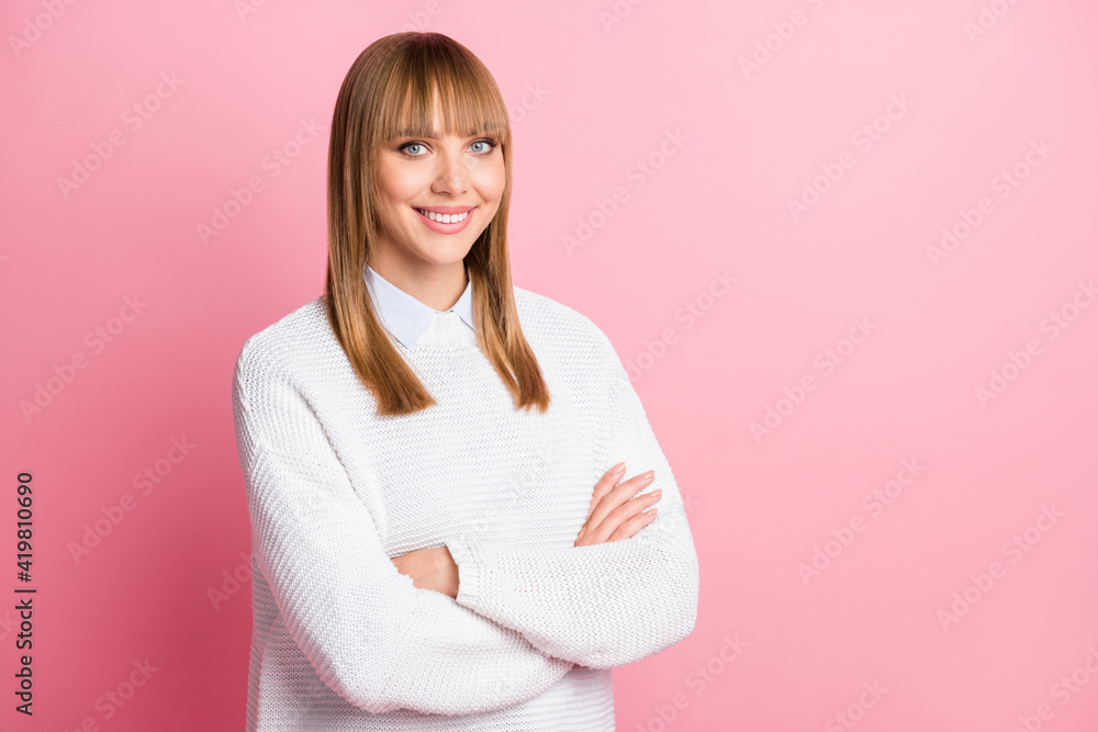 Photo of young happy positive confident successful confident woman with crossed arms isolated on pink color background Photo of young happy positive confident successful confident woman with crossed arms isolated on pink color background
