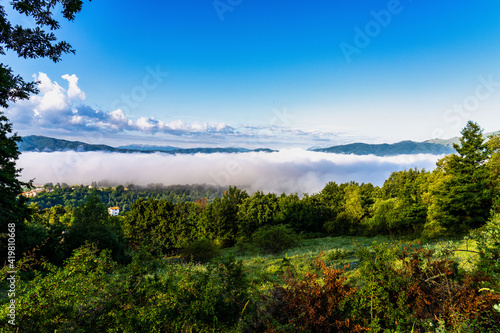 Foggy view from the hills of San Capone to the Sibillini mountains park in Italy