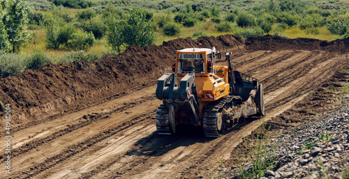 Track-type bulldozer. Earth-moving equipment.