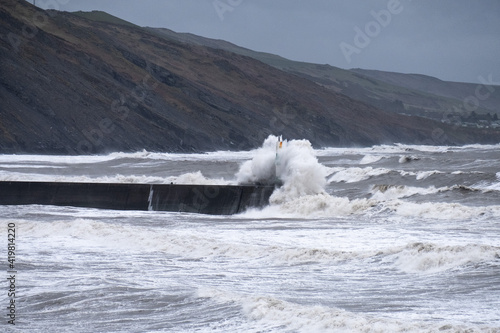 Gale force winds and high tide produce massive waves that crash into the seafront in Aberystwyth.