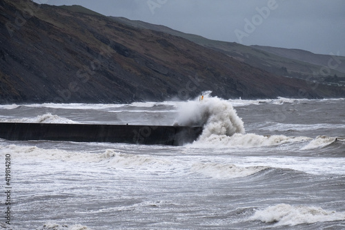Gale force winds and high tide produce massive waves that crash into the seafront in Aberystwyth.