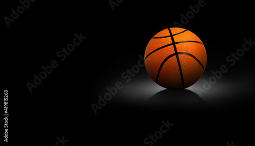 Basketball ball on black background © pornchai