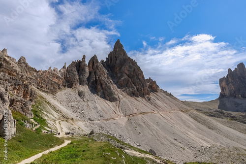 Tourist trail near the mountain range in Tre Cime Natural Park. South Tyrol, Italy