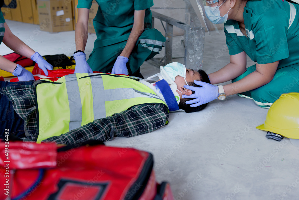 First aid for injuries in work accidents. Using first aid equipment