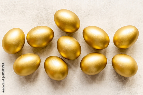 Set of golden eggs. Easter decoration. Wealth and good luck concept. Overhead view
