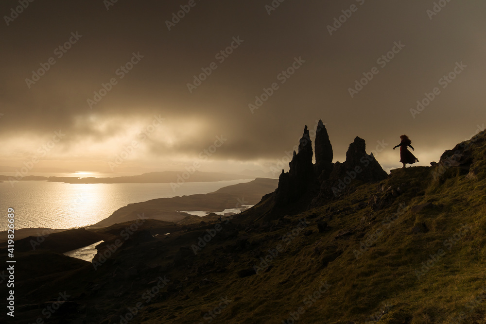 Landscape view at sunset with colourful clouds of Old Man of Storr rock formation, Scotland, United Kingdom.