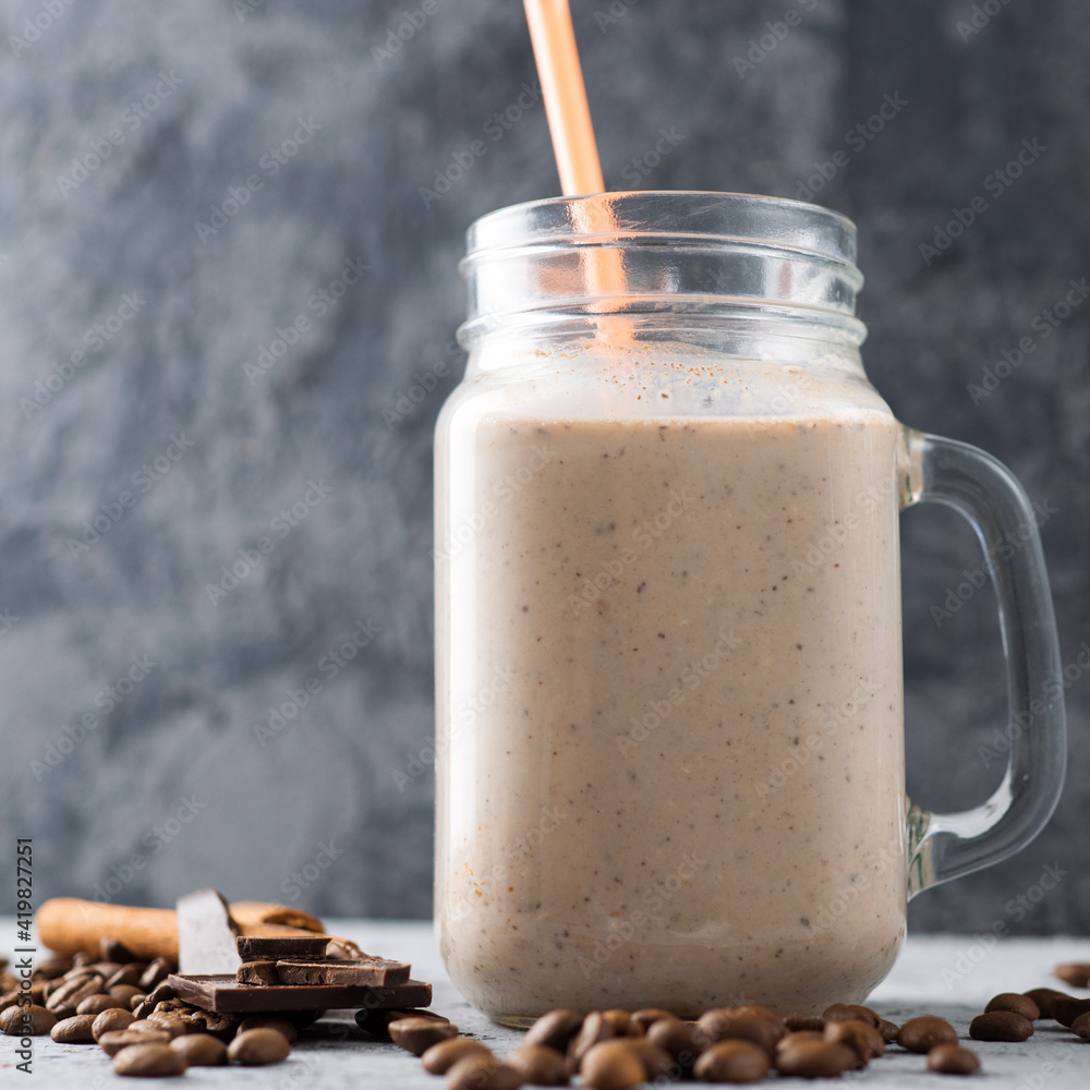 Glass jar of milk chocolate cocktail with coffee Glass jar of milk chocolate cocktail with coffee