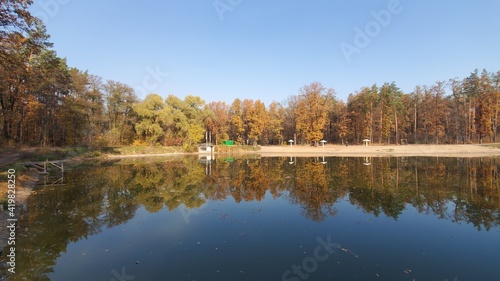 autumn trees reflected in water