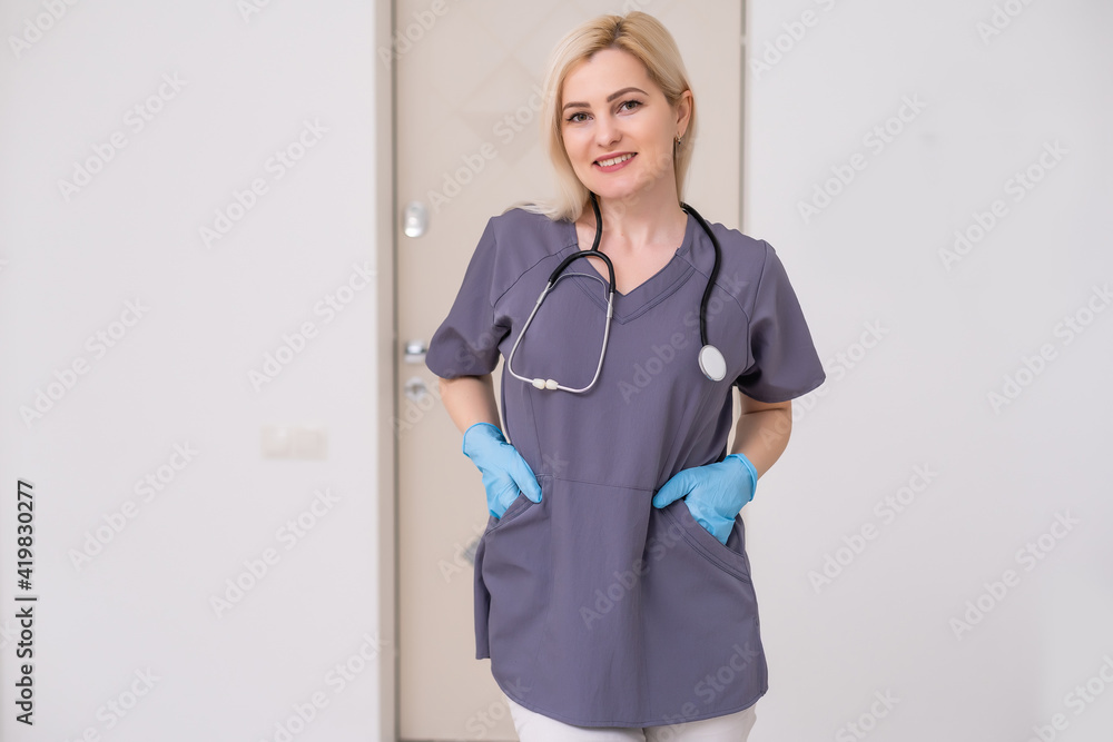 Smiling medical woman doctor. Isolated over white background
