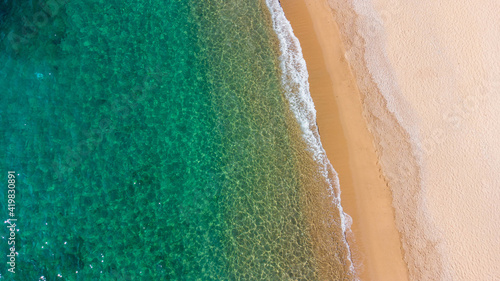 aerial view of water sea on the beach with turquoise colors