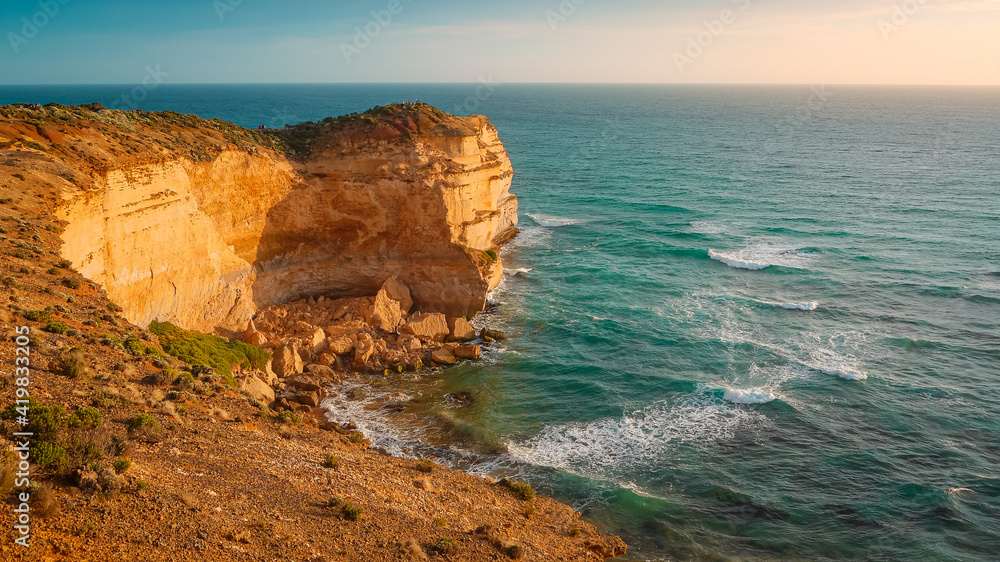 Coastline at the Great Ocean Road in Australia at sunset