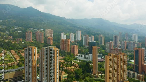 Drone Descending Above El Poblado Neighborhood on Cloudy Day in Medellin, Colombia photo