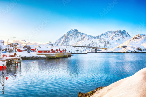 Winter view of small fishing village on Sundstraumen strait and Kakern Bridge