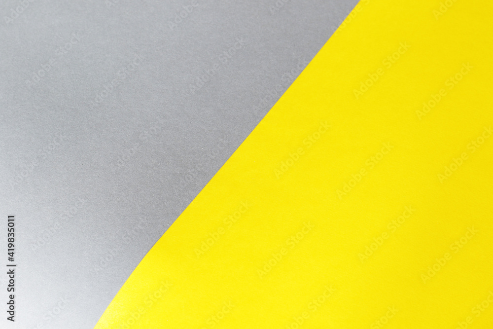 empty illuminate yellow and grey paper background. colour trend of the year 2021 empty illuminate yellow and grey paper background. colour trend of the year 2021