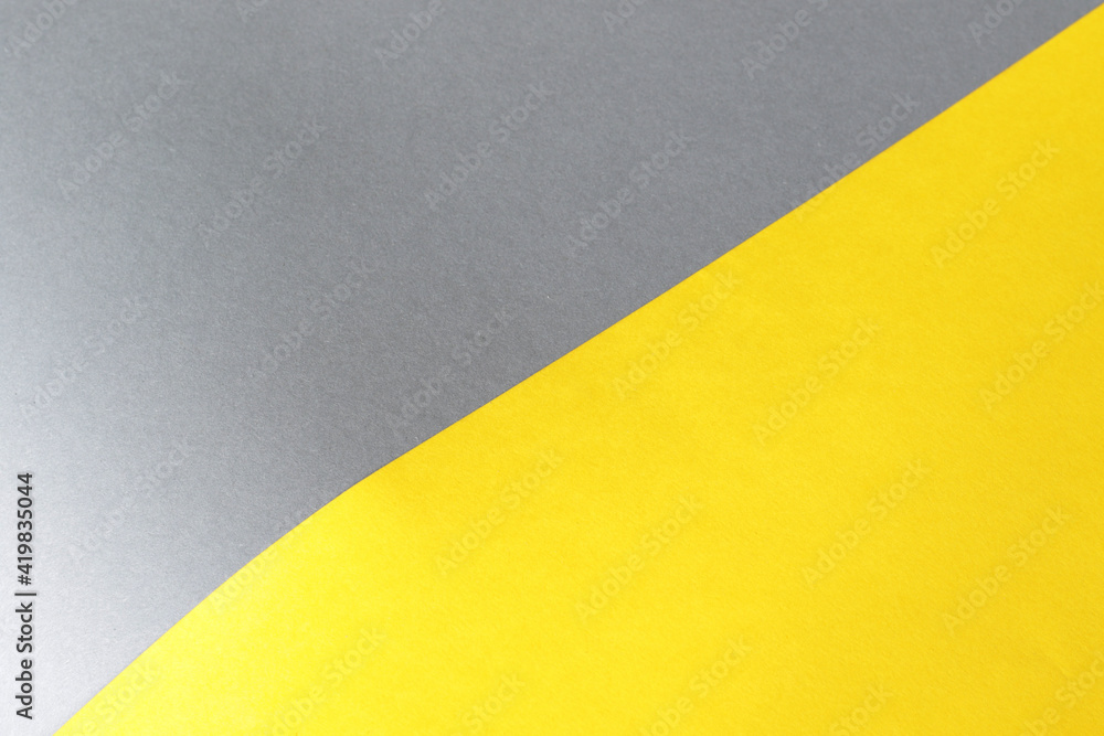 empty illuminate yellow and grey paper background. colour trend of the year 2021 empty illuminate yellow and grey paper background. colour trend of the year 2021