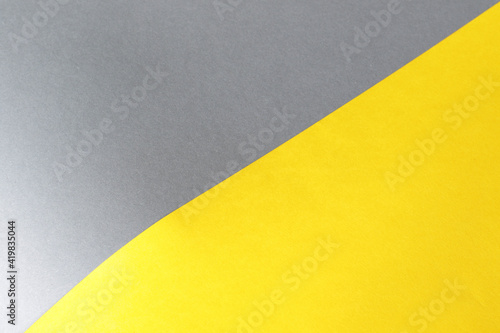 empty illuminate yellow and grey paper background. colour trend of the year 2021