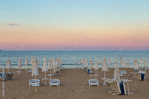 Fototapeta Naklejka Na Ścianę i Meble -  morning , sunbeds and parasols on the beach,