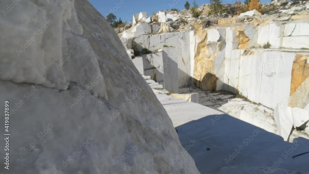 Industrial marble quarry site with huge marble blocks Quarry of white marble. Industrial marble quarry site with huge marble blocks Quarry of white marble.