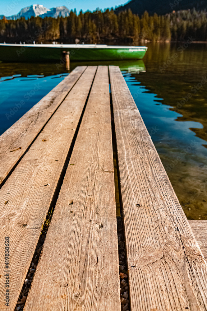 Fototapeta premium Beautiful alpine autumn or indian summer landscape shot with reflections at the famous Hintersee, Ramsau, Berchtesgaden, Bavaria, Germany