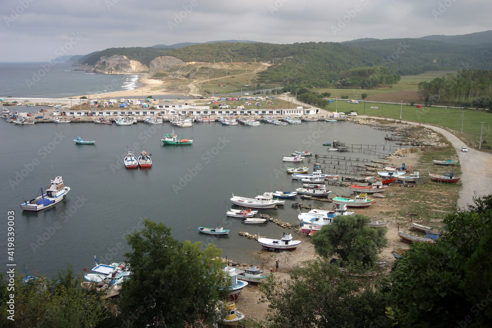 Fishing boats and harbor at beautiful village Kiyikoy in Kirklareli, Turkey.