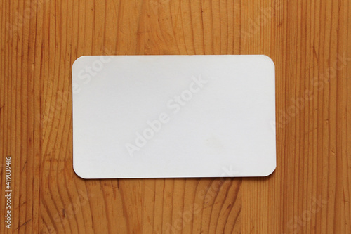 White paper on a wooden texture.