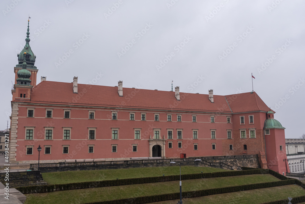 Fototapeta premium Warsaw old town skyline with people walking around. Warsaw old town panorama on a sunny day. Arial imaging of Royal castle in Warsaw.