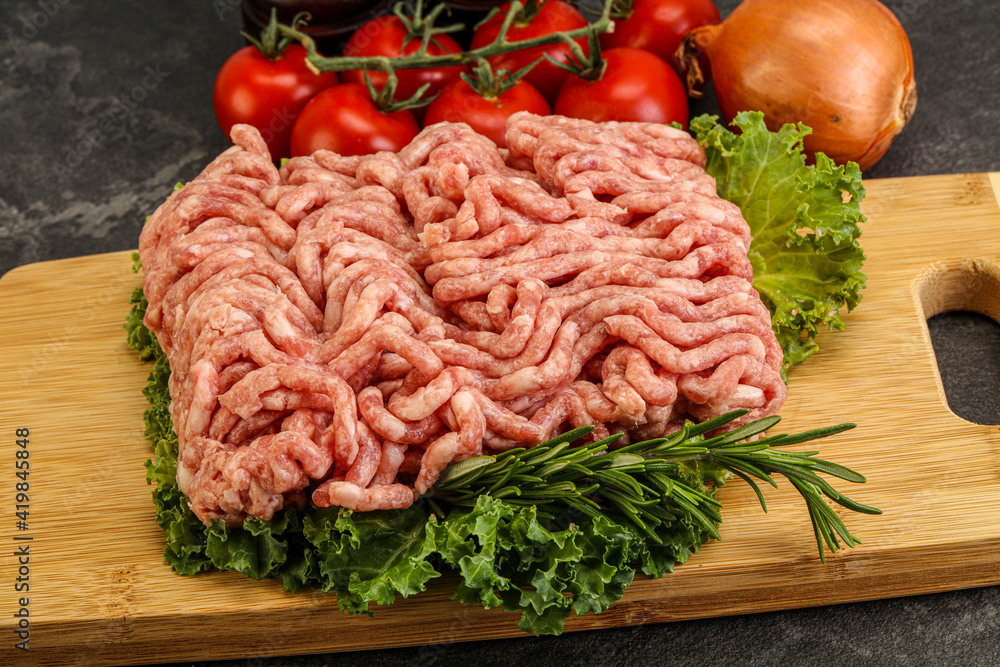 Raw pork minced meat over board Raw pork minced meat over board