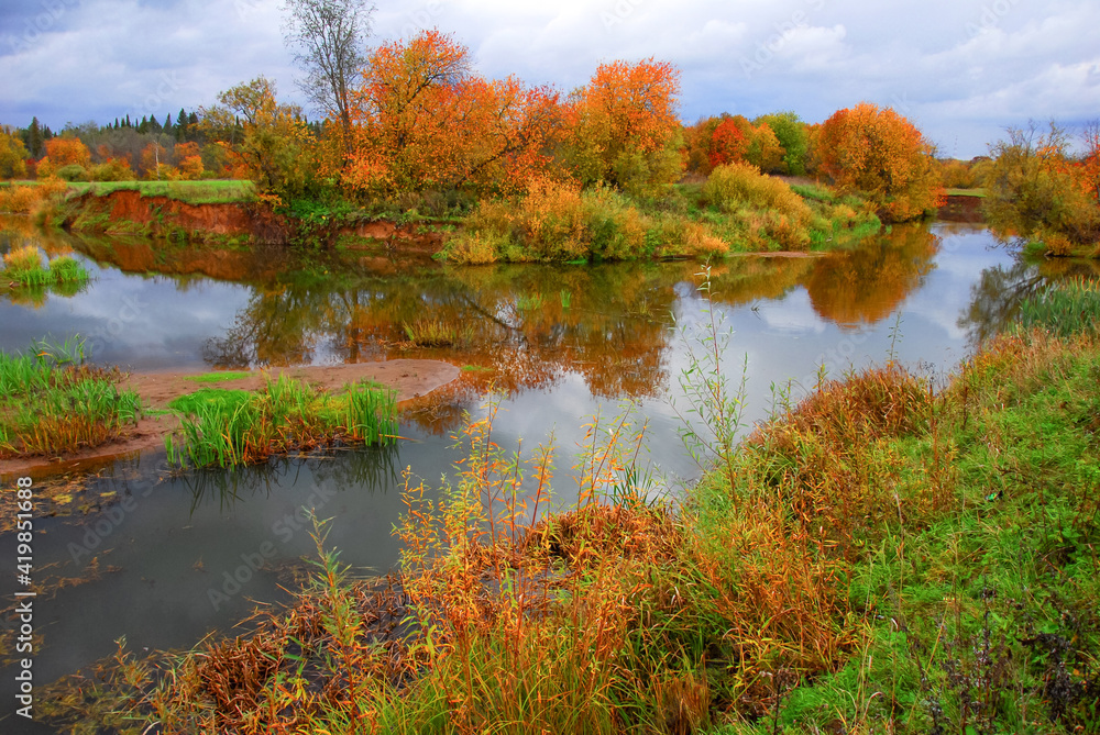 Autumn. October. Yellow trees by the river 