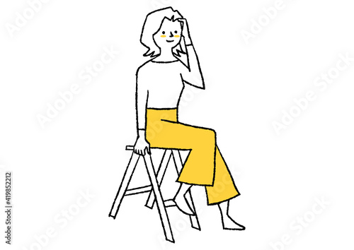 脚立に座る女性