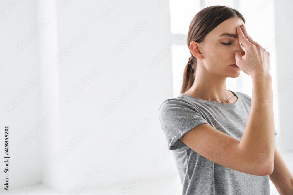 Attractive young woman practicing meditation Attractive young woman practicing meditation