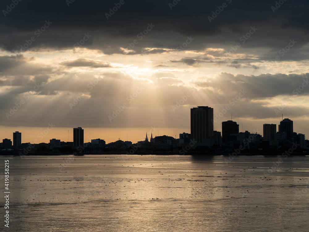 the sky is open, spectral rays in the city of guayaquil, as seen from duran, 