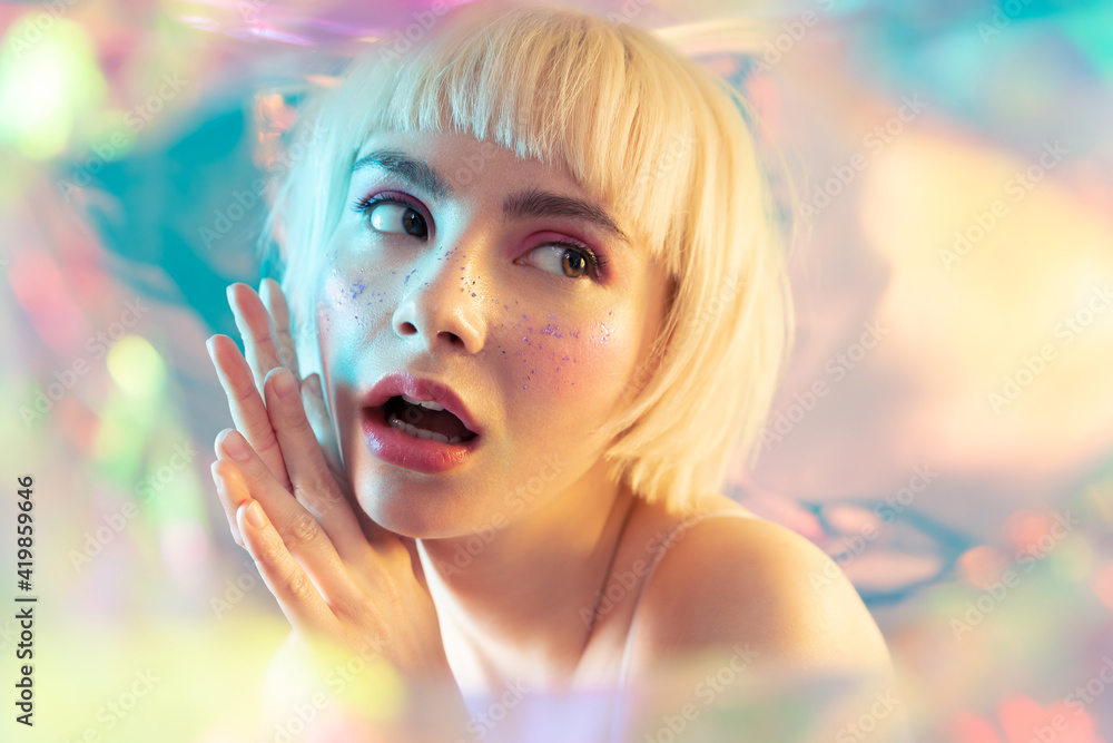 Cool young girl with short blond hair, healthy smooth glowing skin on