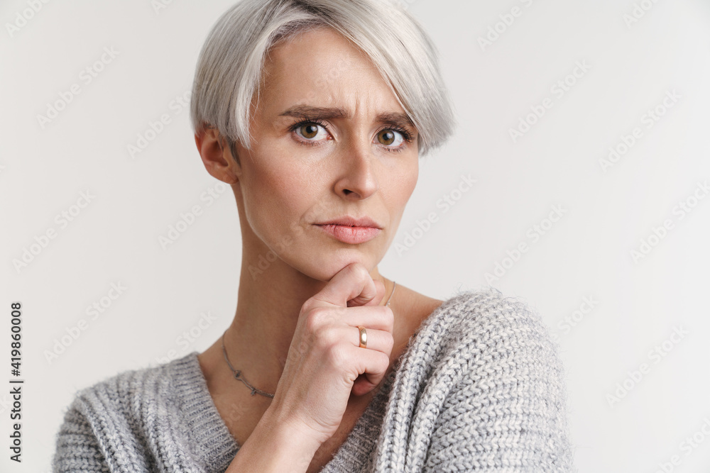 White-haired displeased woman posing and looking at camera White-haired displeased woman posing and looking at camera