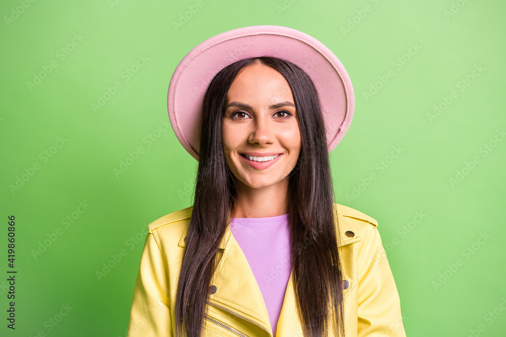 Photo portrait of brunette girl wearing autumn outfit smiling isolated on bright green color background Photo portrait of brunette girl wearing autumn outfit smiling isolated on bright green color background