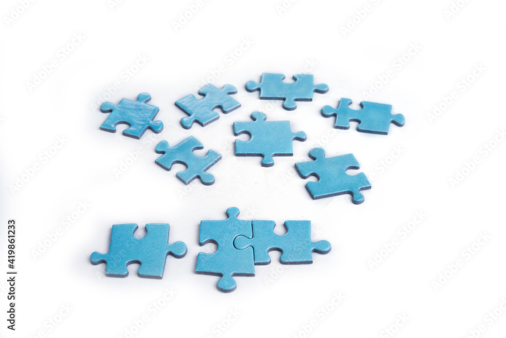 Puzzles on a white background. Solution and teamwork concept Puzzles on a white background. Solution and teamwork concept