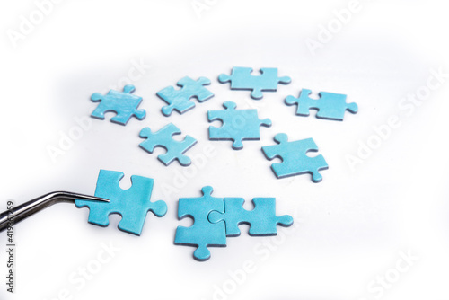Puzzles on a white background. Solution and teamwork concept