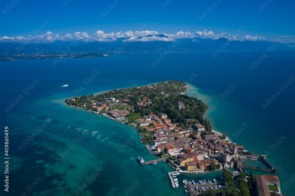 Aerial view on Sirmione sul Garda. Italy, Lombardy. Panoramic view at high altitude.  Rocca Scaligera Castle in Sirmione. View by Drone.