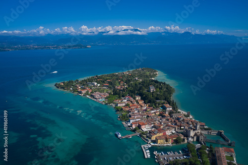 Aerial view on Sirmione sul Garda. Italy, Lombardy. Panoramic view at high altitude. Rocca Scaligera Castle in Sirmione. View by Drone.