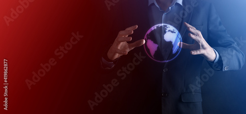 Businessman with protective gesture standing posture hand holding Earth icon , digital globe