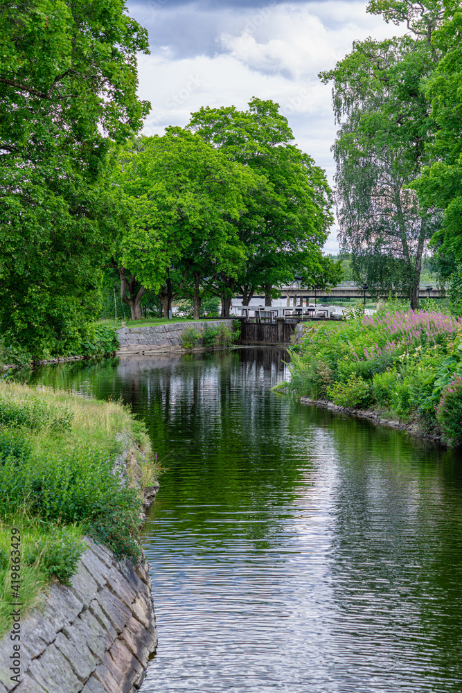 Lush green summer view along the Stromsholms canal in Sweden