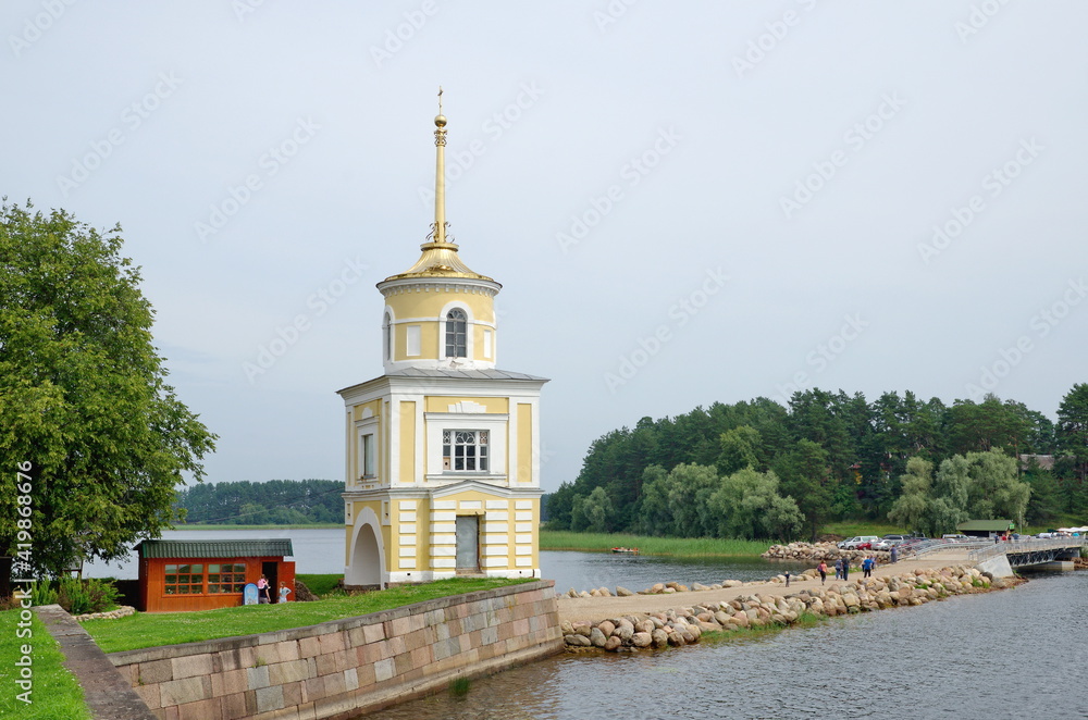 Nilo-Stolobenskaya Pustyn Monastery in the Tver region, Russia. Summer view of the Svetlitskaya Tower and Lake Seliger