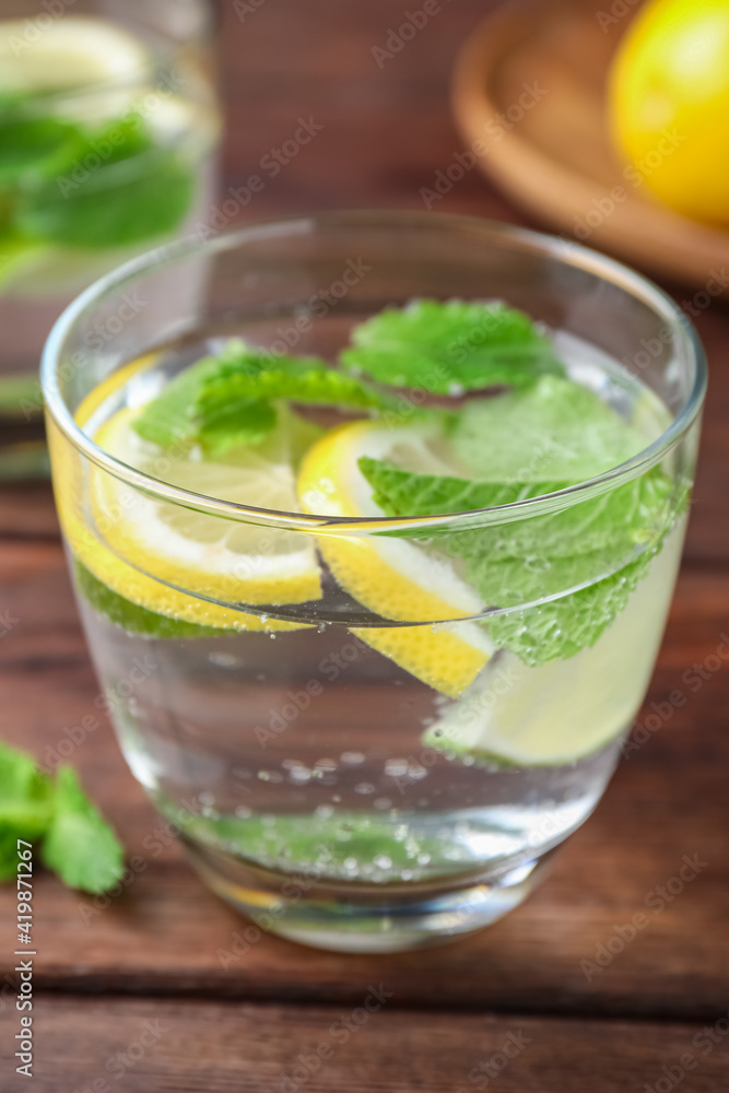 Tasty refreshing lemonade on wooden table, closeup. Summer drink Tasty refreshing lemonade on wooden table, closeup. Summer drink